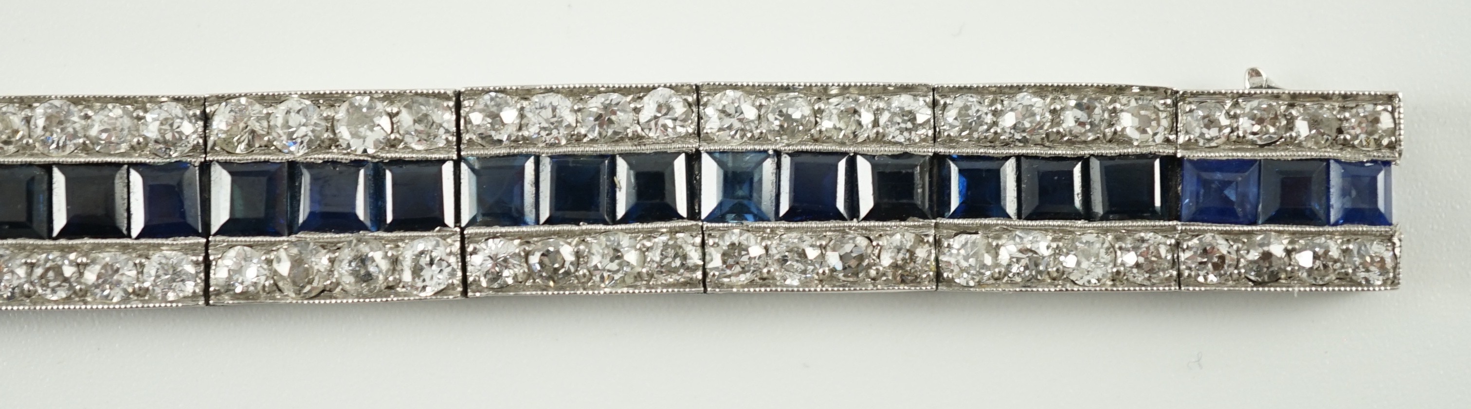 A 1920’s white gold, sapphire and diamond set triple line bracelet